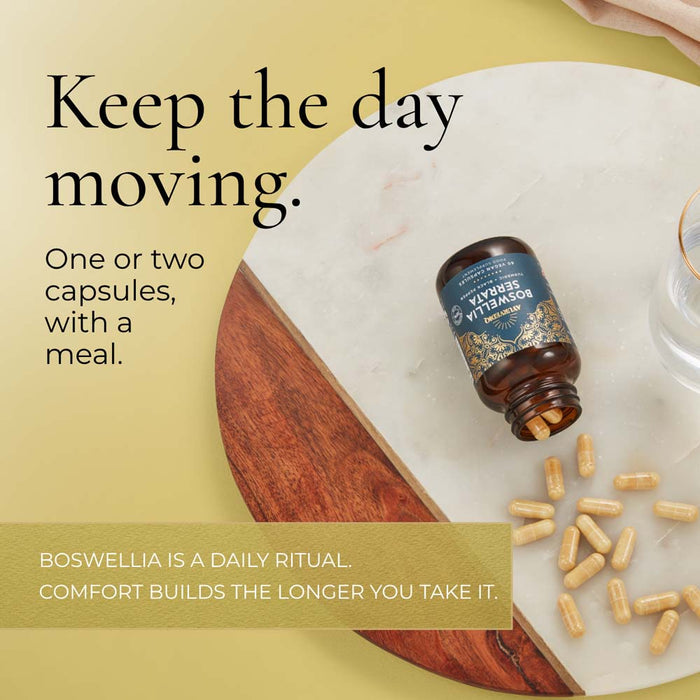 A bottle of Boswellia capsules lies on a white marble board with several capsules scattered. Text reads, 'Keep the day moving.