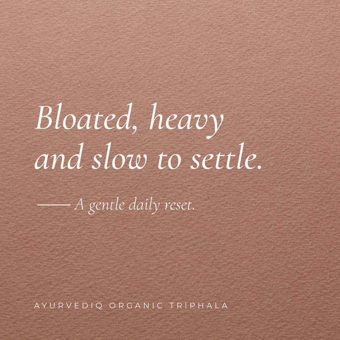 A square product image featuring a textured dusty rose background with white text. The main text reads 'Bloated, heavy and slow to settle - a gentle daily reset'