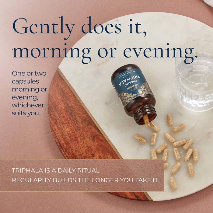 A bottle of Triphala Organic capsules with text 'Gently does it, morning or evening.'