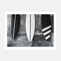 A photo wall art print featuring black and white surfboards