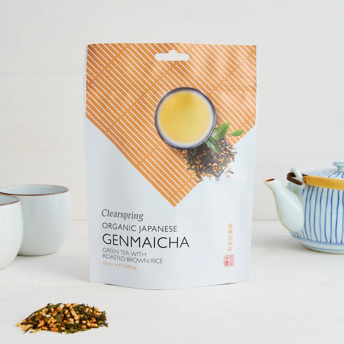Clearspring Organic Japanese Genmaicha green tea packaging with a cup and teapot on a white background