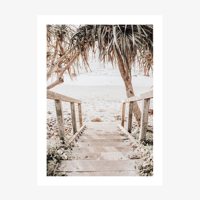A photo wall art print featuring steps leading down to the beach of an Australian coastal town