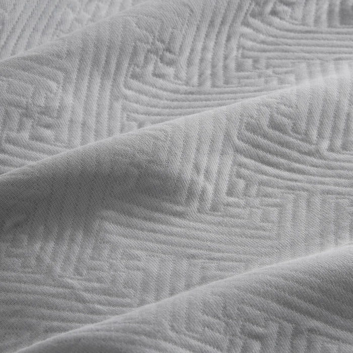 Colcha tejida + funda cojín Lines perla detalle