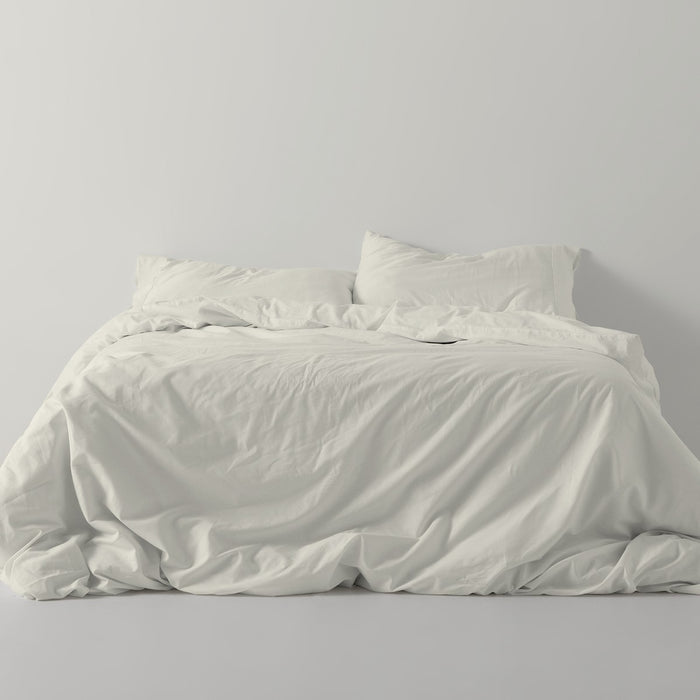 Funda nórdica lisa algodón crema escena de cama