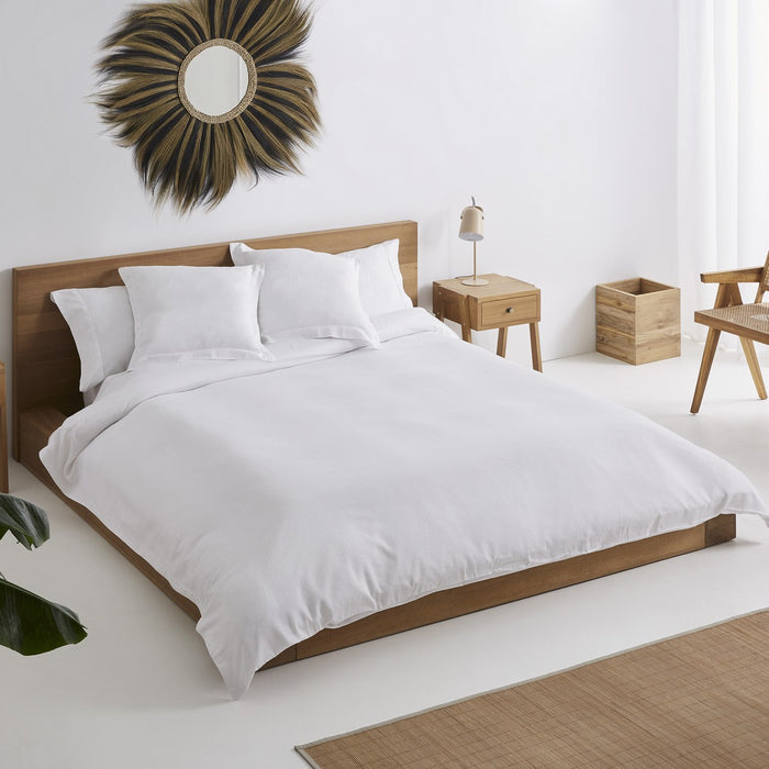 Funda nórdica tejida Piles blanco escena de cama