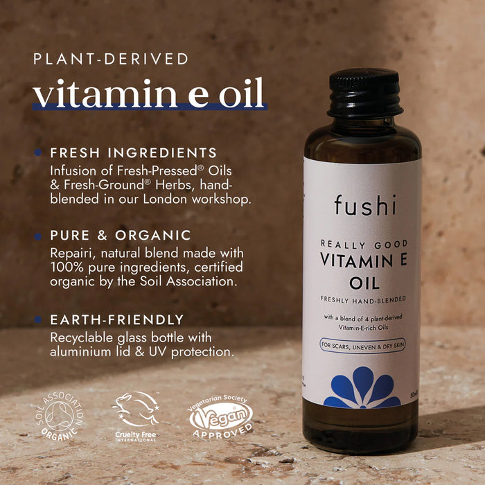 Fushi Vitamin E oil bottle with product details on a wooden background