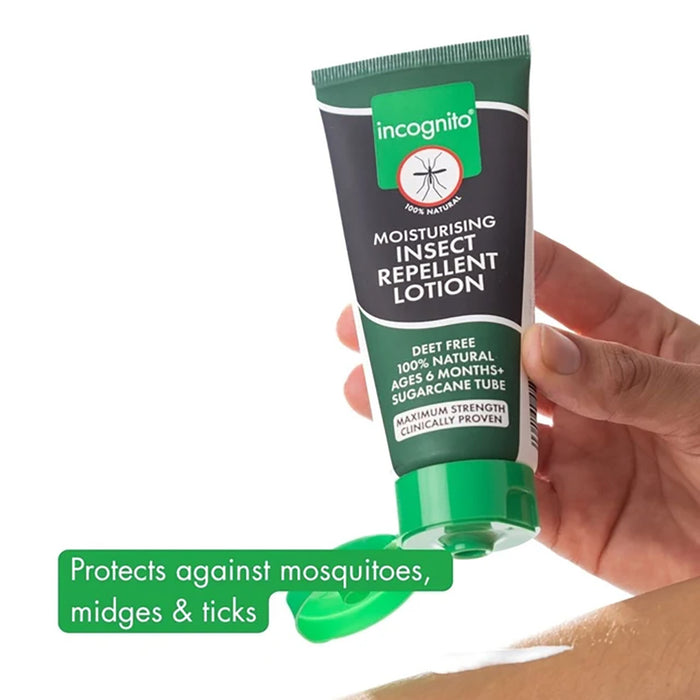 Tube of incognito moisturising insect repellent lotion held by a hand on a white background