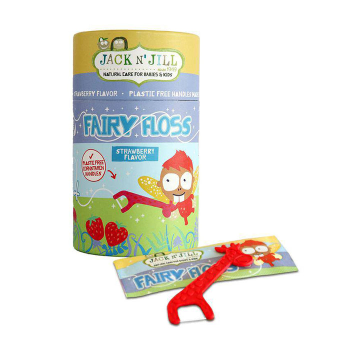 Jack N' Jill Fairy Floss strawberry flavor oral hygiene set, featuring a cylindrical packaging container with colorful cartoon graphics and a small red plastic floss tool resting in front on a white background.