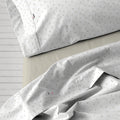 Juego de sábanas Íber piedra escena de cama detalle dibujo