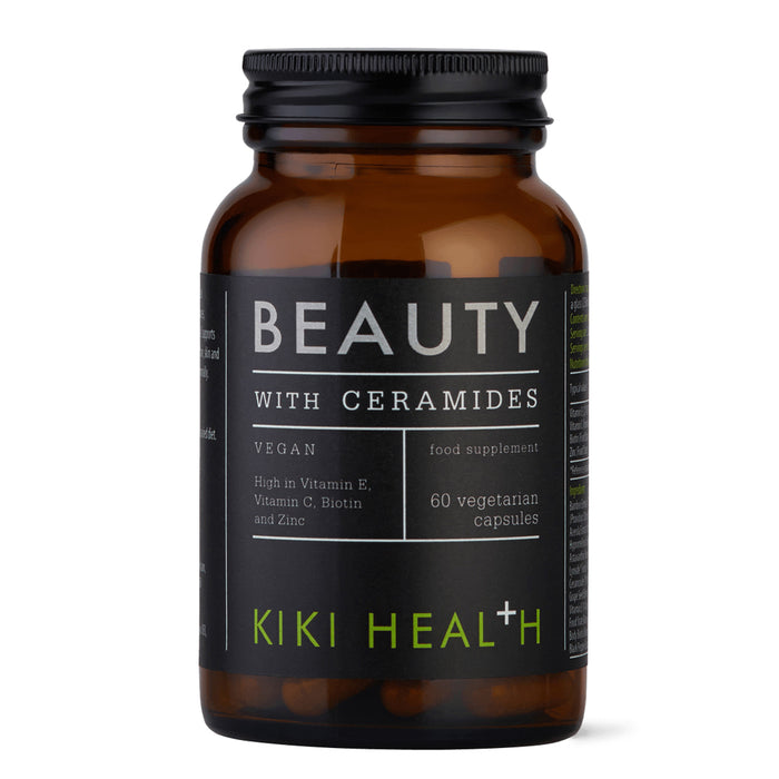 Black supplement bottle labeled 'Beauty with Ceramides' on a white background