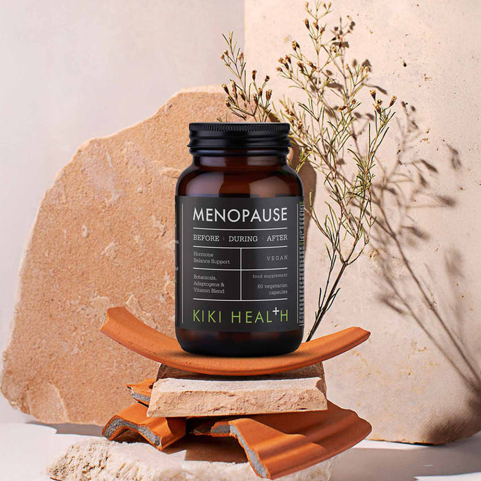 KIKI HEALTH Menopause supplement bottle on a natural stone background