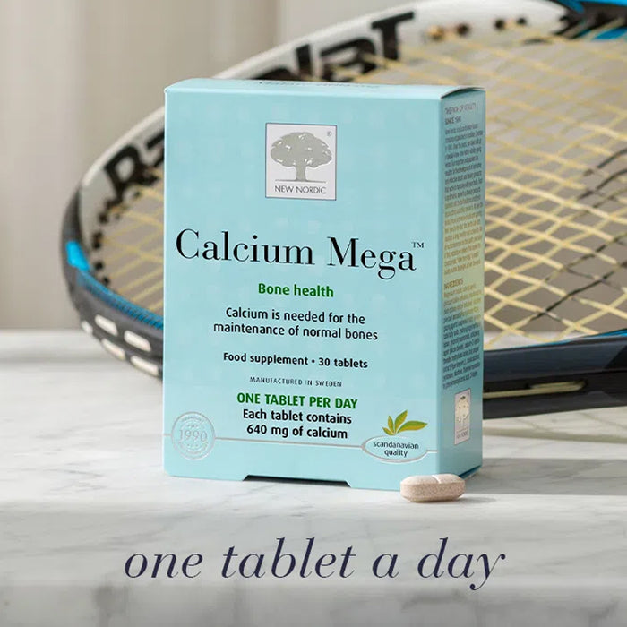 Box of Calcium Mega supplement with a tennis racket in the background