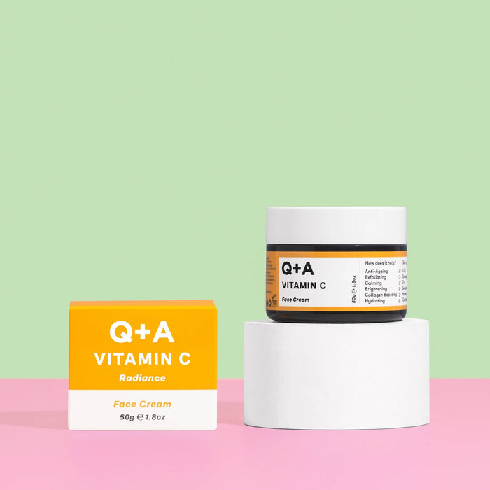Q+A Vitamin C face cream jar and box on a pink and green background