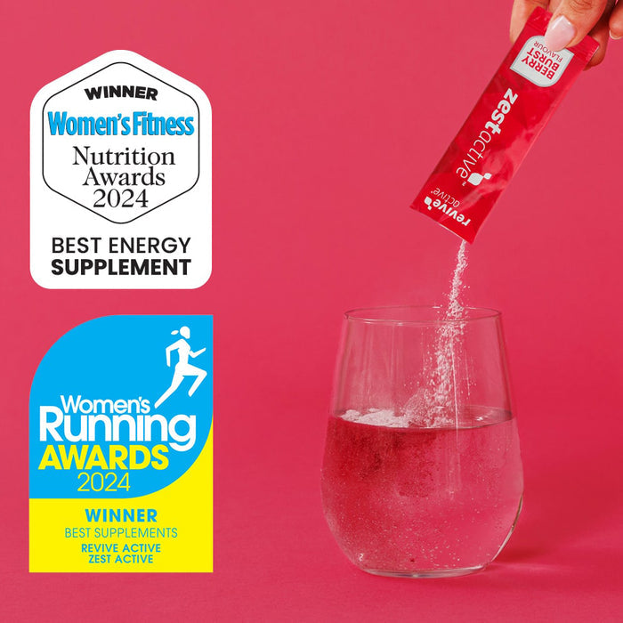 Zest Active supplement being poured into a glass with awards displayed on a pink background