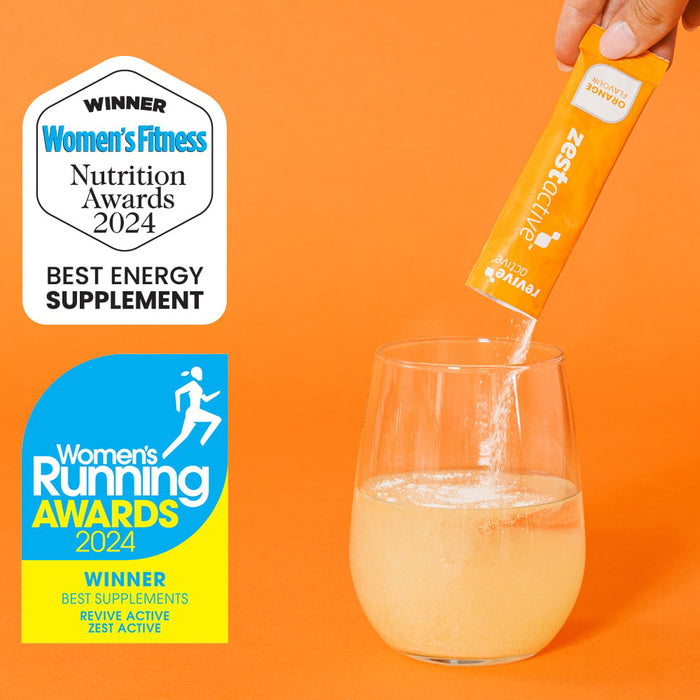 Zest Active supplement being added to a glass with awards on an orange background