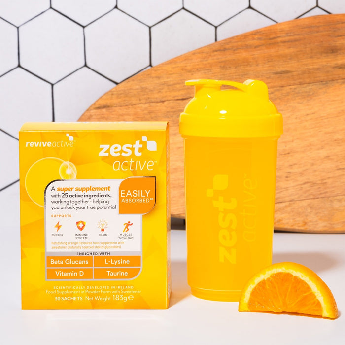 Zest Active supplement package with a yellow shaker and orange slice on a white surface.