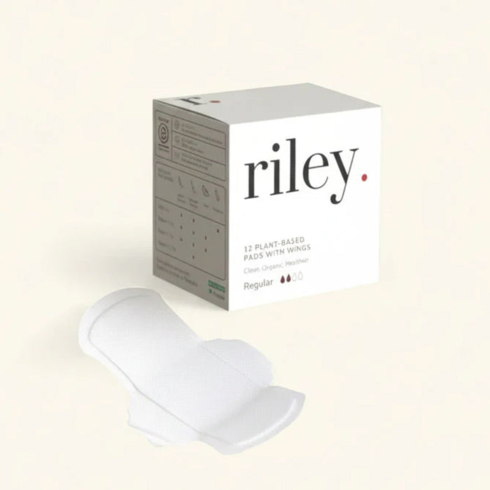 White sanitary pad with 'riley' packaging on a light beige background