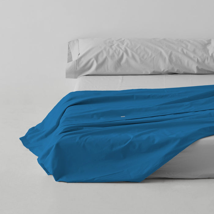 Sábana encimera algodón poliéster azul cendre escena de cama