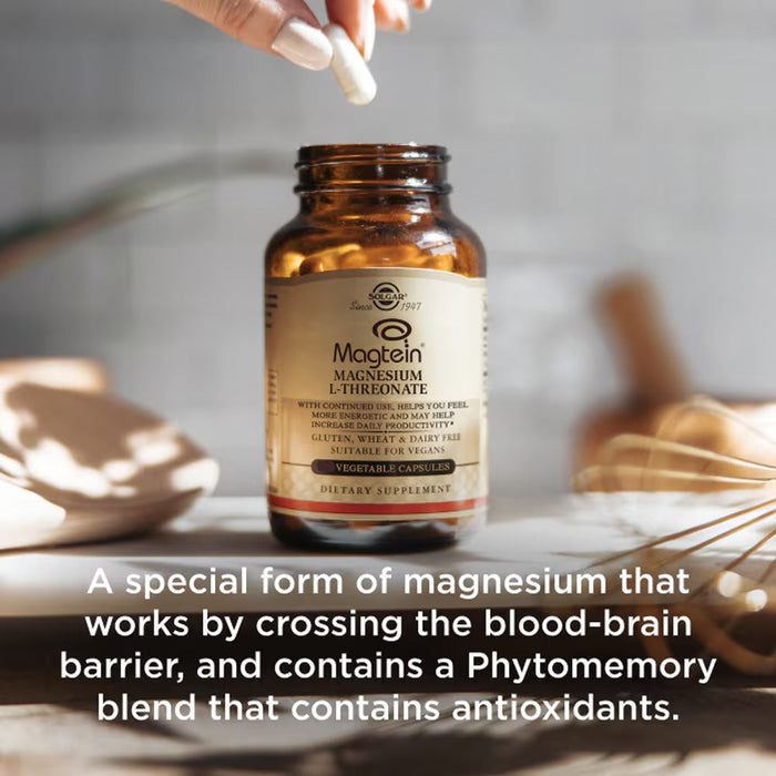 Supplement bottle labeled 'Magtein' with a hand holding a capsule on a neutral background.