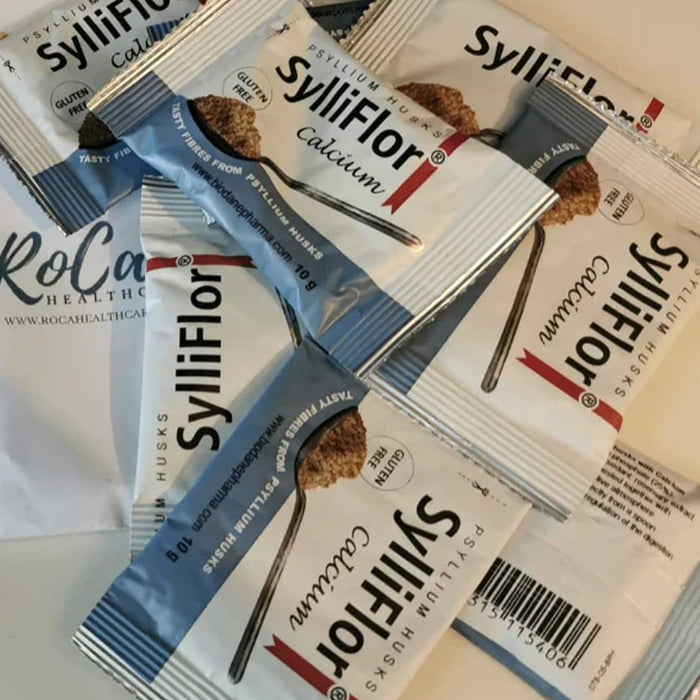 Several SylliFlor Calcium protein husk snack packets arranged on a white surface.