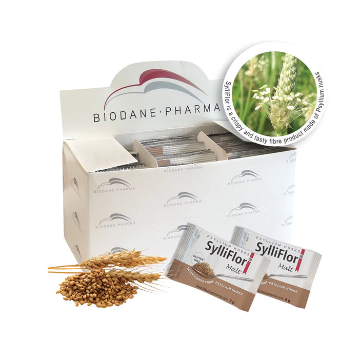 SylliFlor Psyllium Husks Malt packets displayed in front of a branded white box, with loose malt grains and wheat stalks on a clean white background.