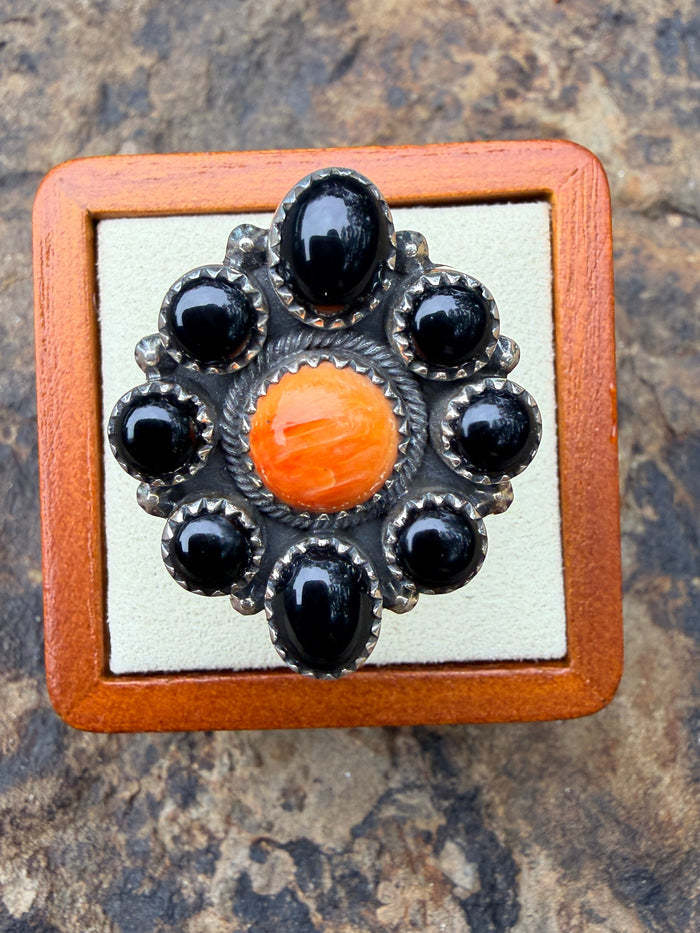 Tony Yazzie 8 Onyx Stones Surrounded by Orange Spiny Oyster with Sterling Silver detailed band. Adjustable Ring