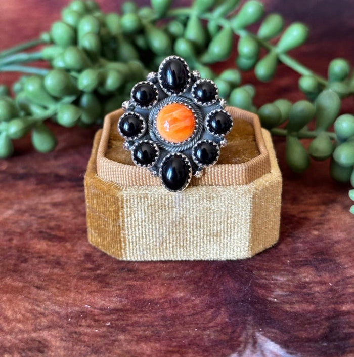 Tony Yazzie 8 Onyx Stones Surrounded by Orange Spiny Oyster with Sterling Silver detailed band. Adjustable Ring