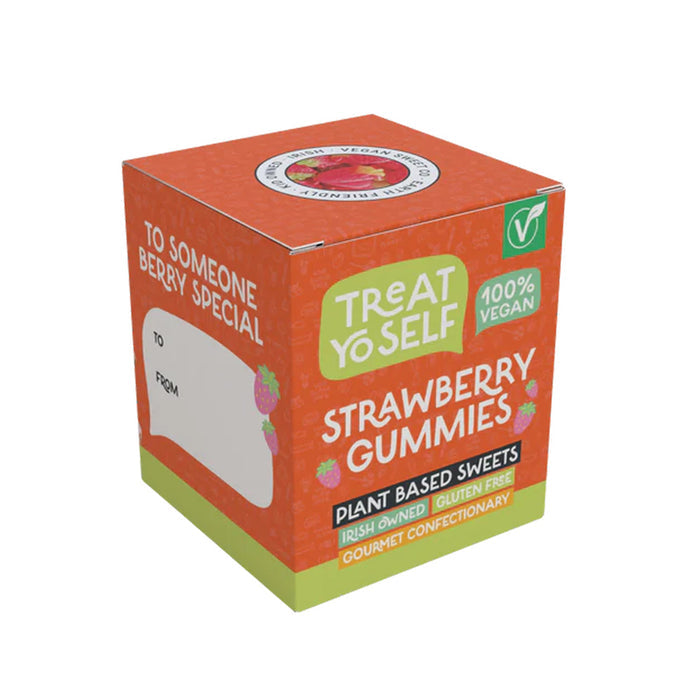 A cube-shaped box of Treat Yo Self Strawberry Gummies, featuring a bright orange and lime green design with white text and small strawberry illustrations.