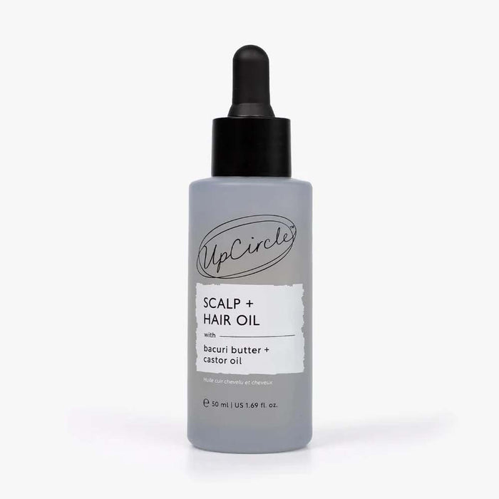 A bottle of UpCircle Scalp + Hair Oil