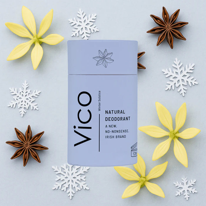 Vico natural deodorant packaging surrounded by decorative flowers and snowflakes on a light blue background