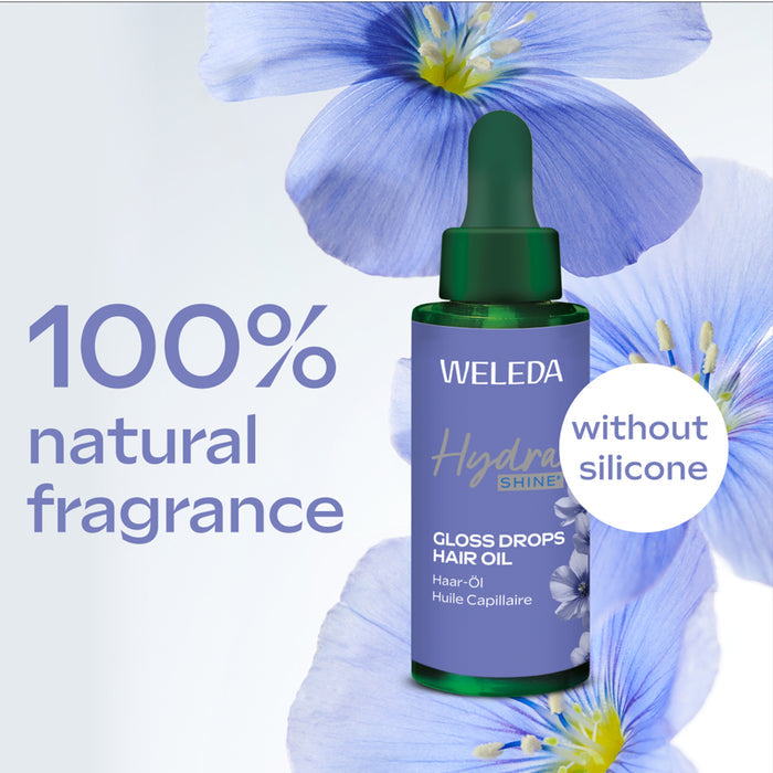Weleda hair oil bottle with blue flowers in the background