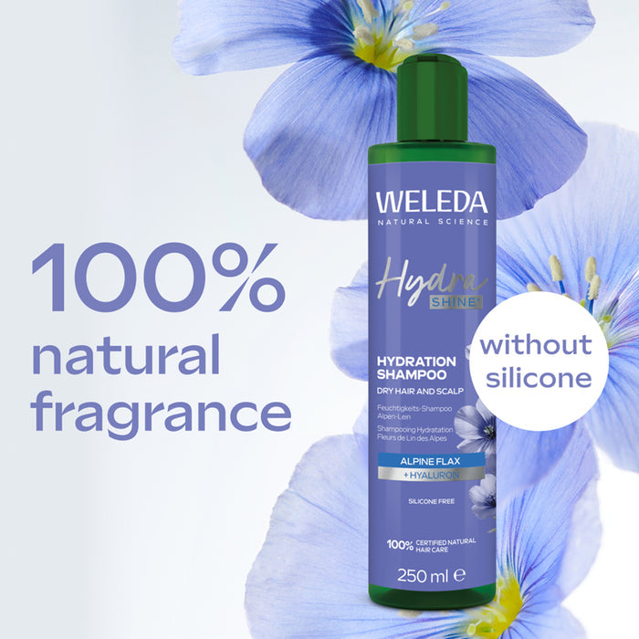 Weleda shampoo bottle with blue flowers and text highlighting natural fragrance and silicone-free ingredients.