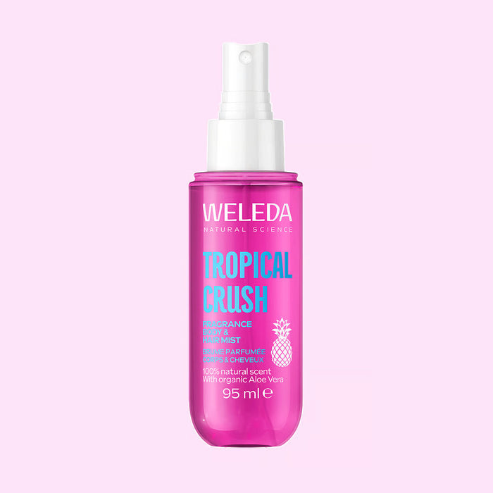 A bottle of Weleda Tropical Crush perfume mist spray.