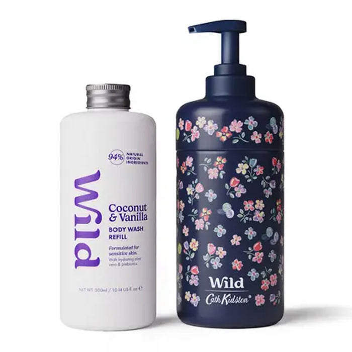 A white bottle of Wild Coconut & Vanilla Body Wash Refill next to a dark navy blue pump bottle with a pink and white floral pattern, both branded with the 'Wild' logo by Cath Kidston.