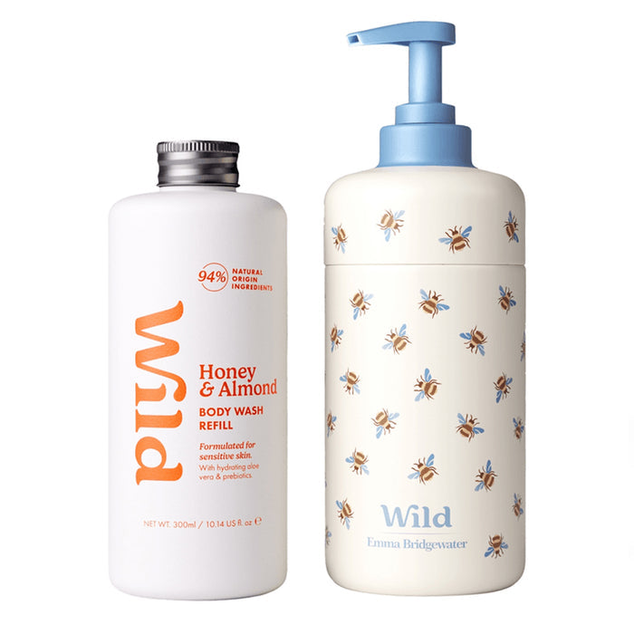 Wild Emma Bridgewater body wash refill bottles on a white background. On the left is a white bottle with a silver cap labeled 'Honey & Almond' in orange.