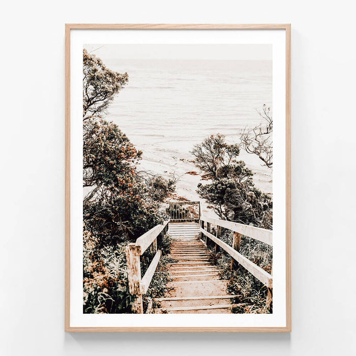 A coatal framed photo wall art print featuring wooden steps down to the beach