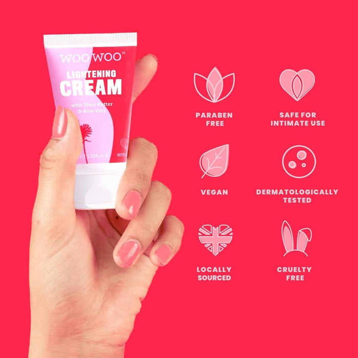 Hand holding a tube of Woowoo Lightening Cream against a red background with product features listed.