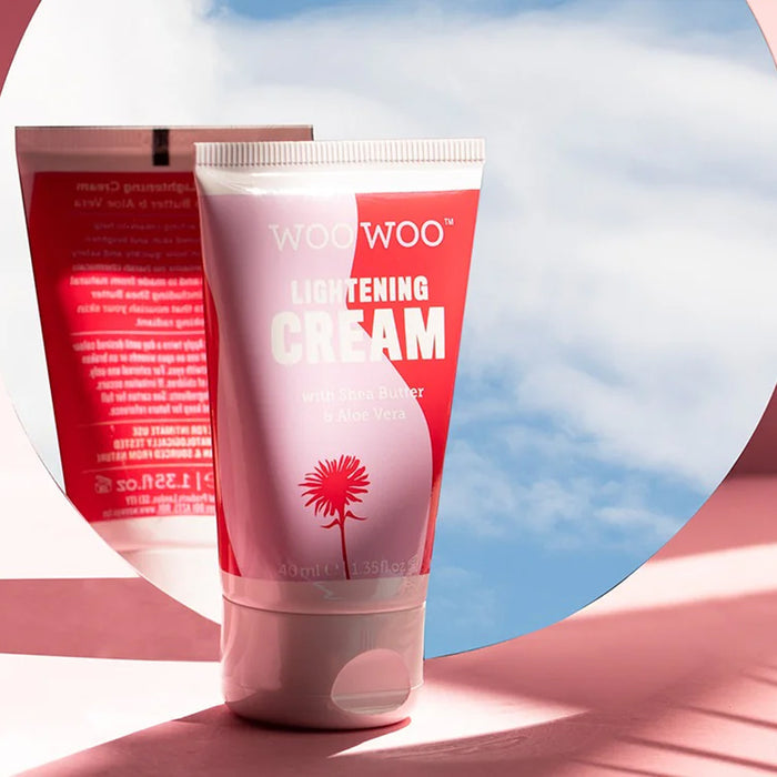 Woo Woo Lightening Cream tube with a pink and white design against a blue sky background