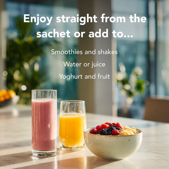 Two glasses of smoothies, a bowl of fruit, and text about consumption options on a table.